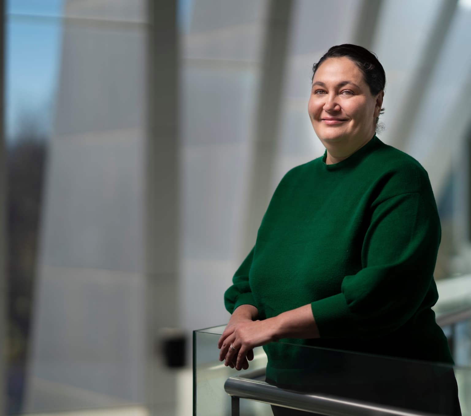 Associate Professor Azure Hermes. She is wearing a green top.