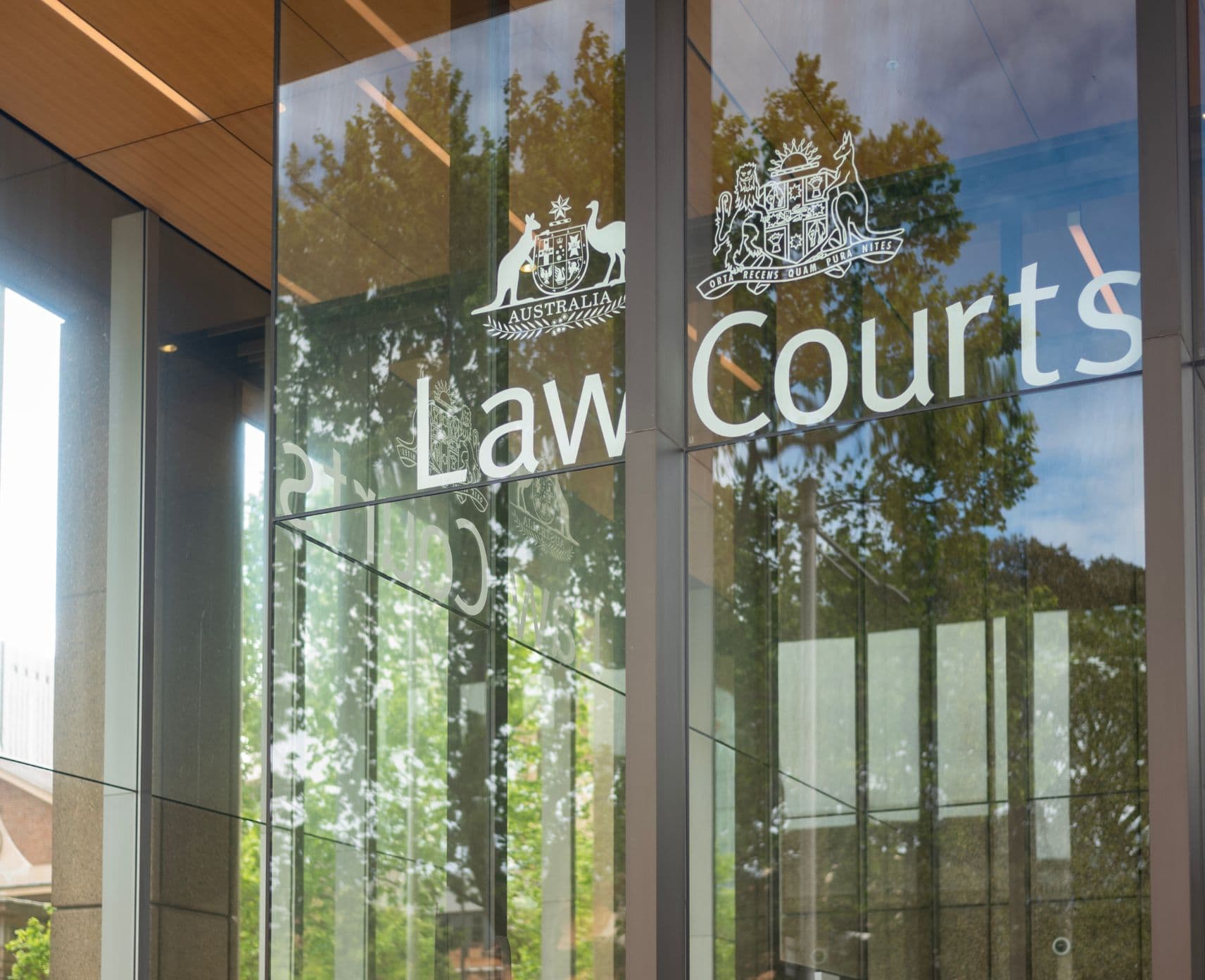 The glass doors of the Law Courts in Sydney