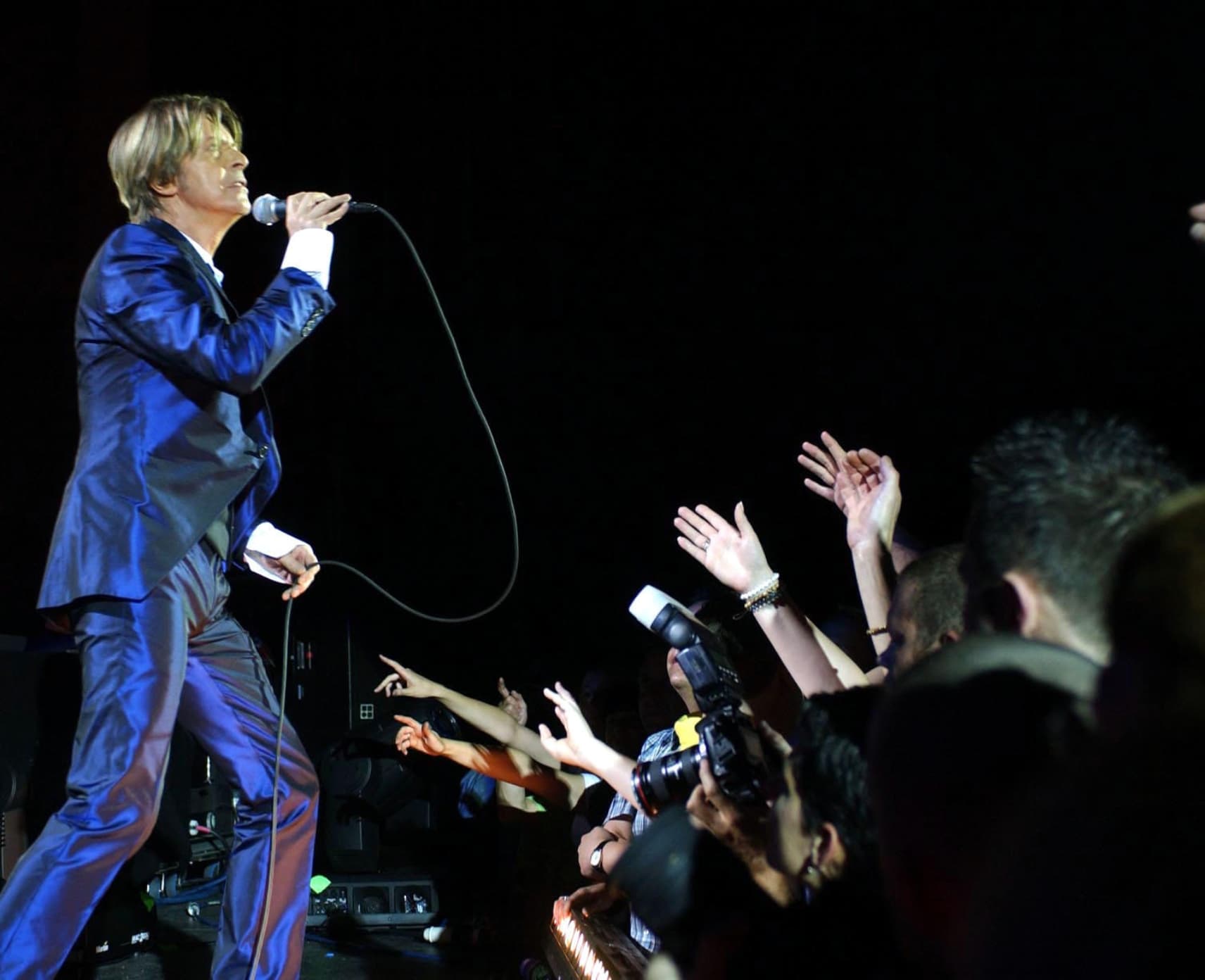 David Bowie performs on stage at the relaunch of the Carling Apollo, Hammersmith, in west London.