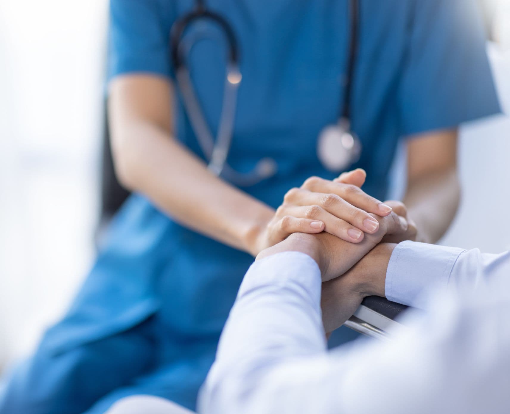 Cropped shot of a female nurse hold her senior patient's hand. Giving Support.