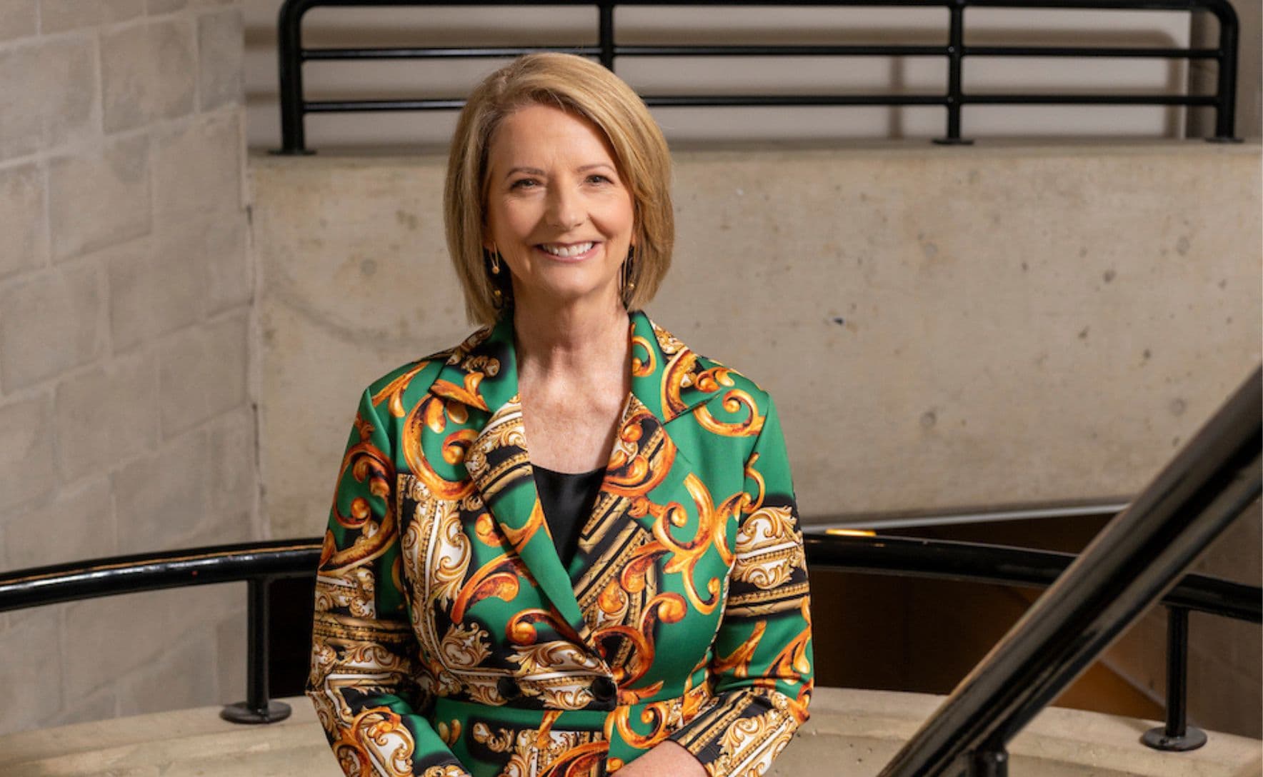 Julia Gillard i a green, orange and gold paisley blazer