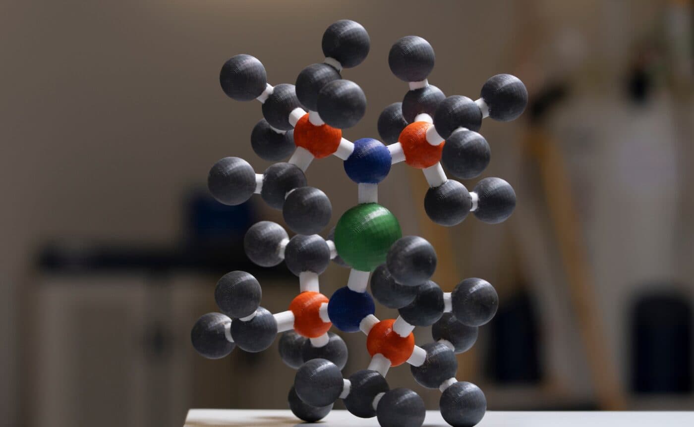A 3D printed structure of the new molecule designed by chemists from ANU and The University of Manchester. The structure is made up of grey, green, blue and orange atoms.