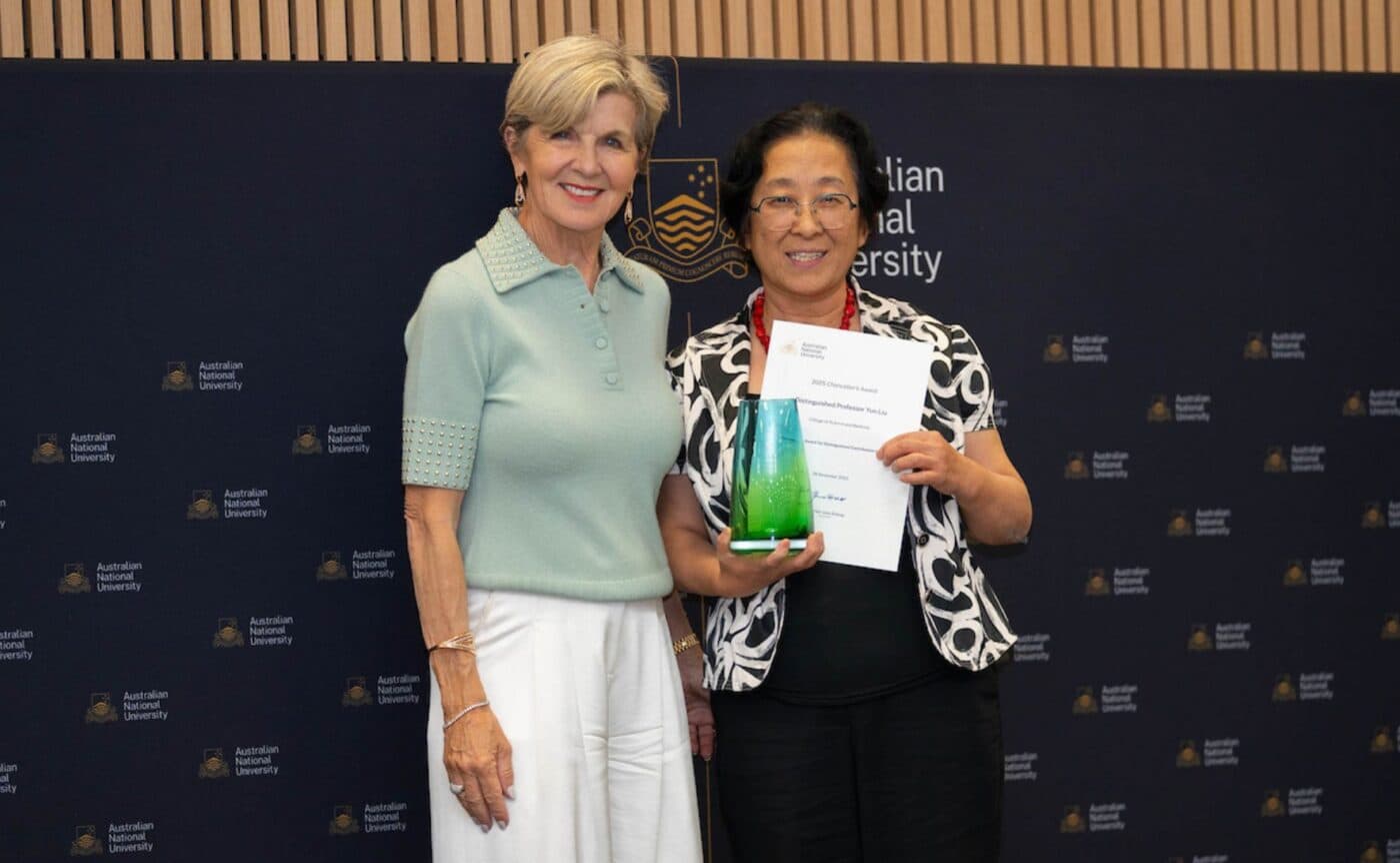 Two people psoe with an award