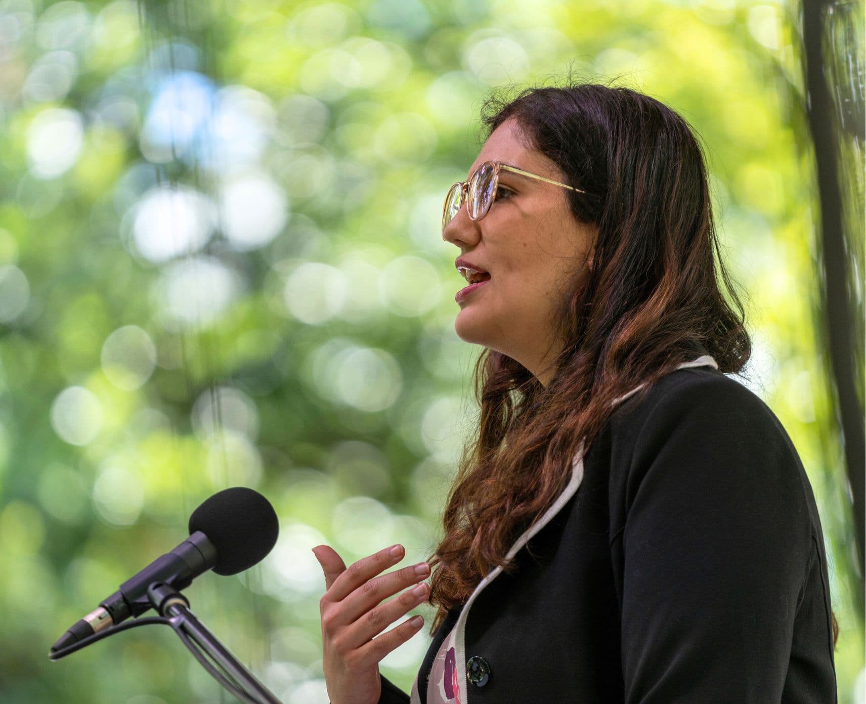 Woman speaks into microphone