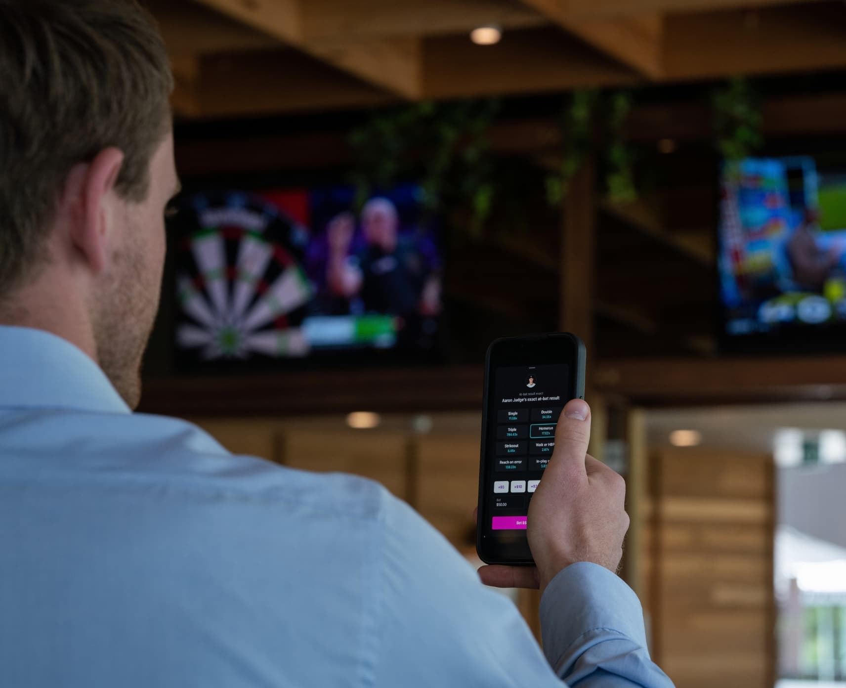 Man looking at screens