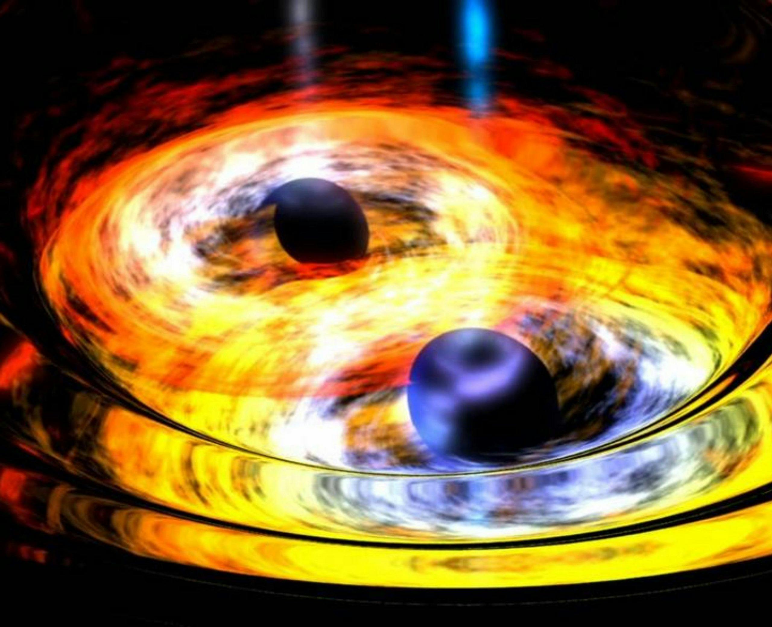 artist impression of two black holes colliding. The image shows two black circles surrounded by circles of yellow and orange light