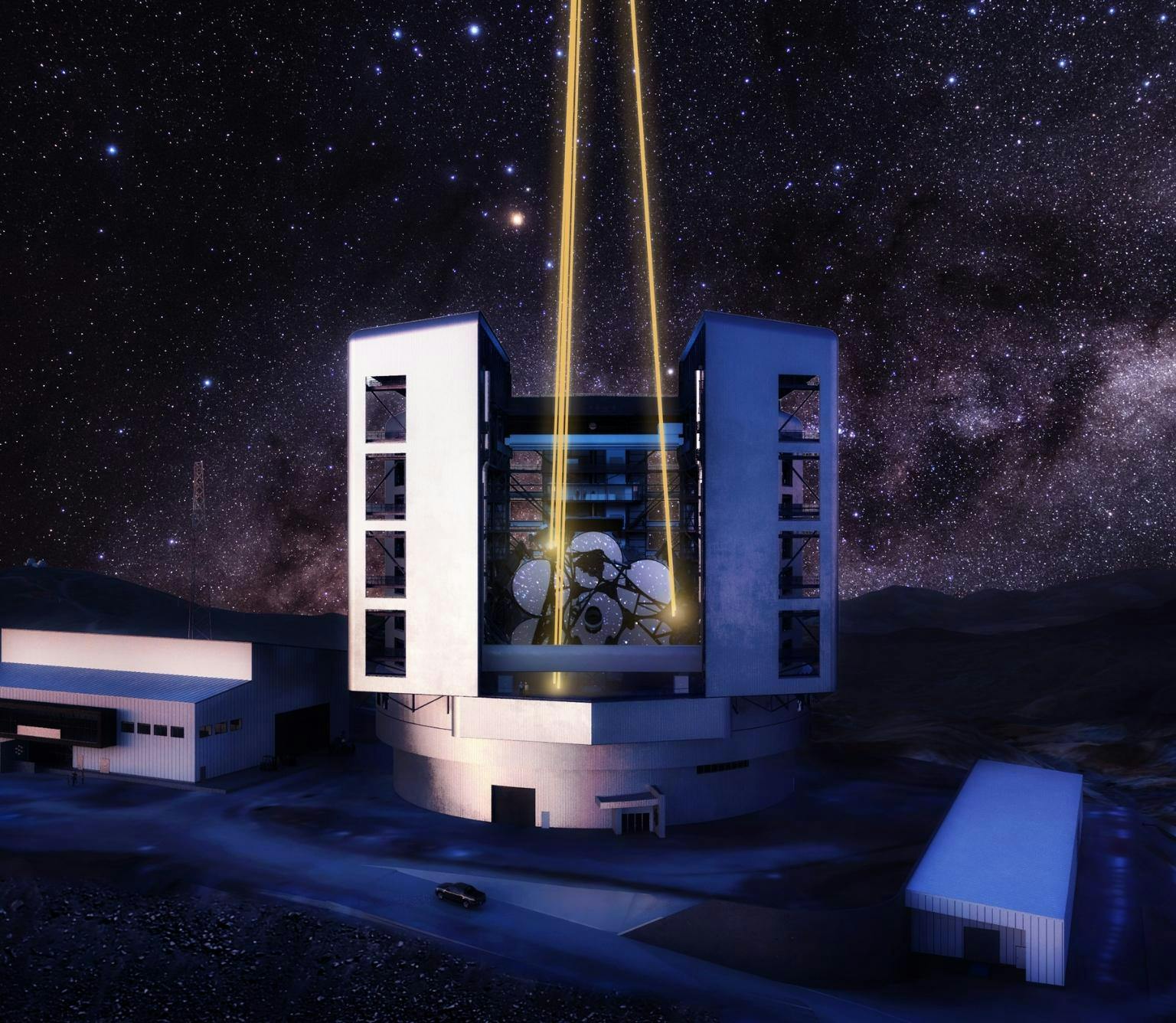 Artists illustration of the GMT telescope. The telescope is a large white structure with two yellow beams of light being emitted towards the sky from the telescope. The background shows the night sky filled with stars.