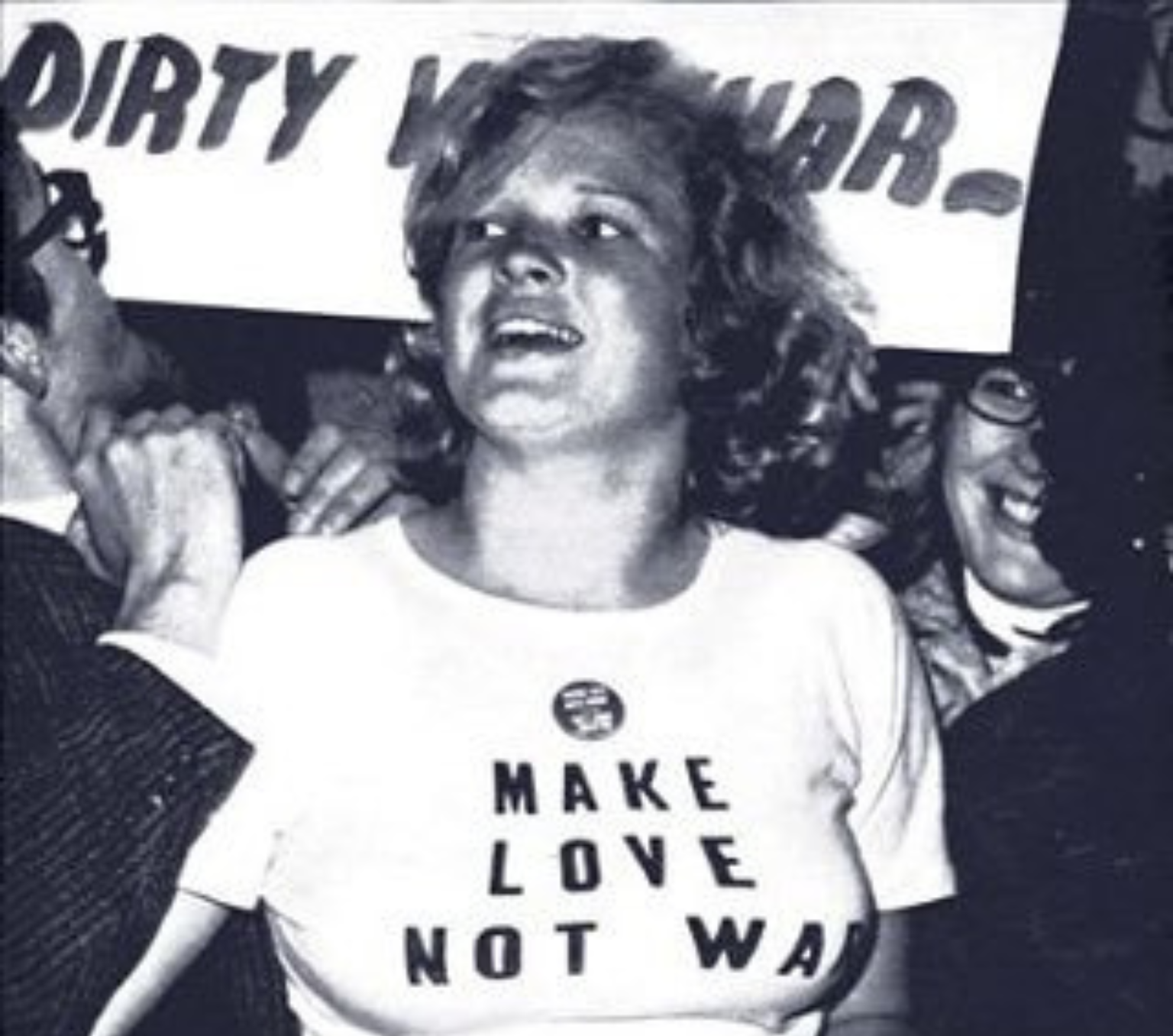 Megan Stoyles pictured in 1966 at a protest wearing a T-shirt that says 'Make Love Not War'.