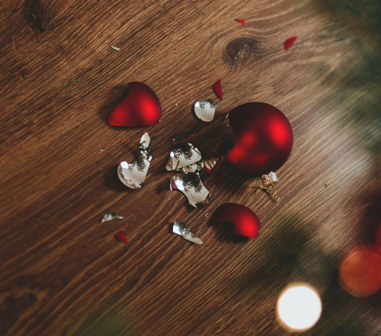 Broken Christmas bauble on the floor.