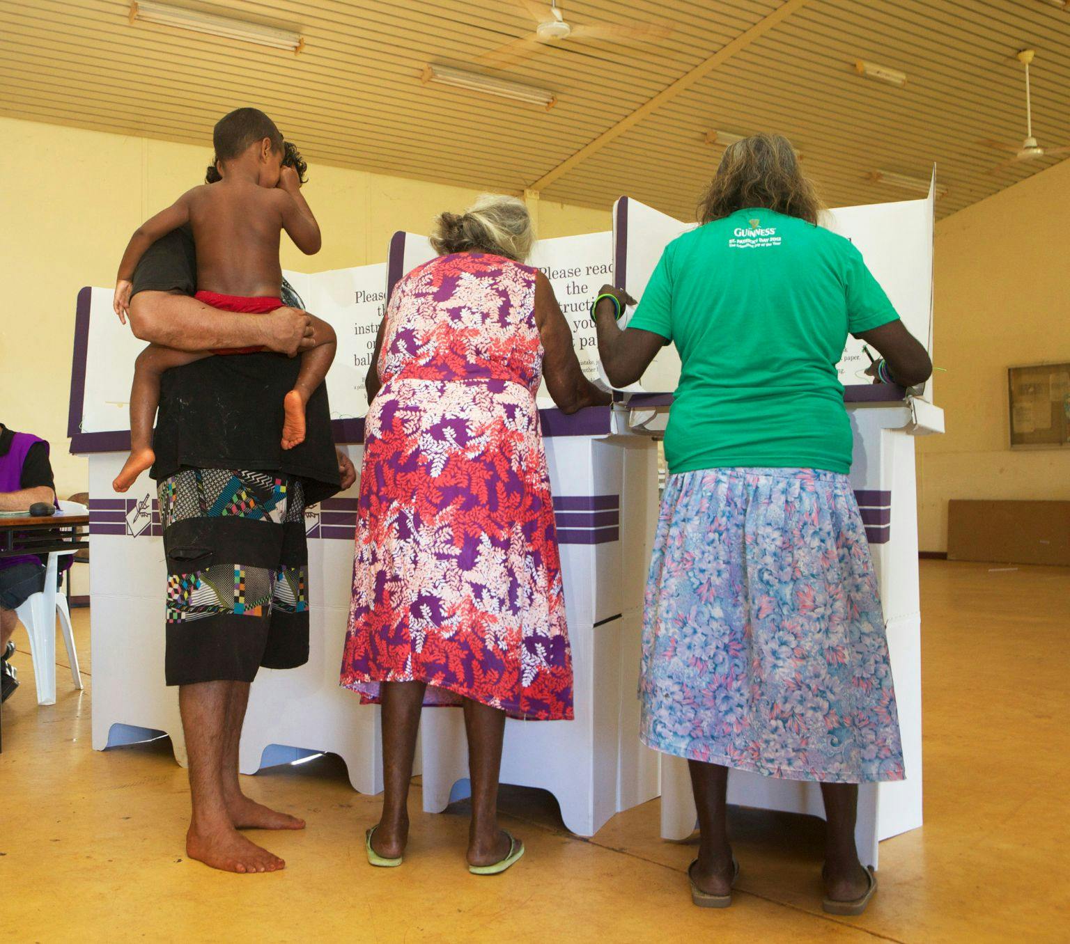Three people voting in an Australian election