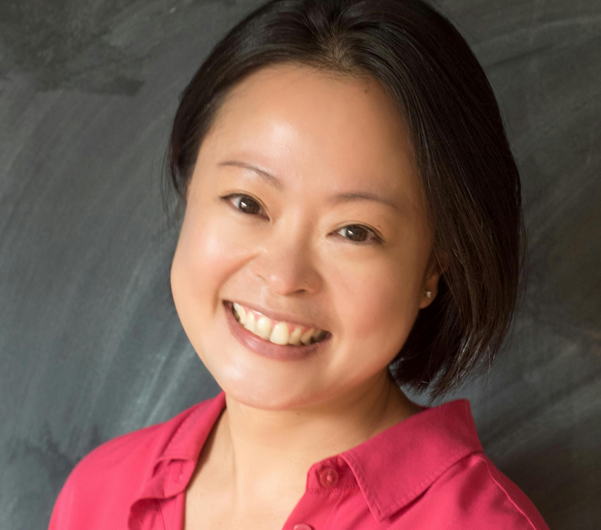 Head and shoulders image of Professor Evelyn Goh. She is smiling and has dark hair