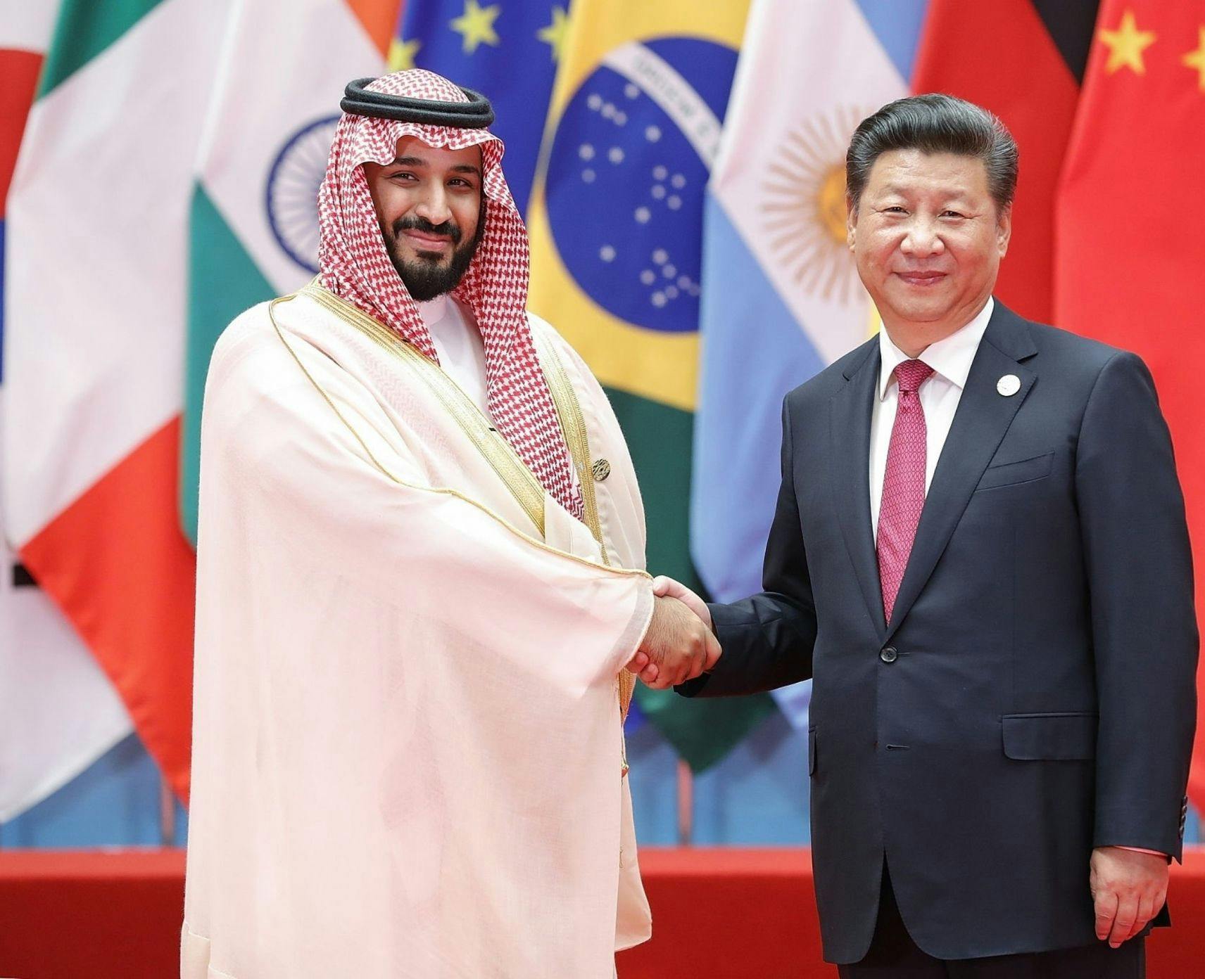 Chinese President Xi Jinping (right) shakes hands with Saudi Deputy Crown Prince and Minister of Defense Mohammed bin Salman bin Abdulaziz Al Saud tat the G20 Summit on Sep 4, 2016 in Hangzhou, China