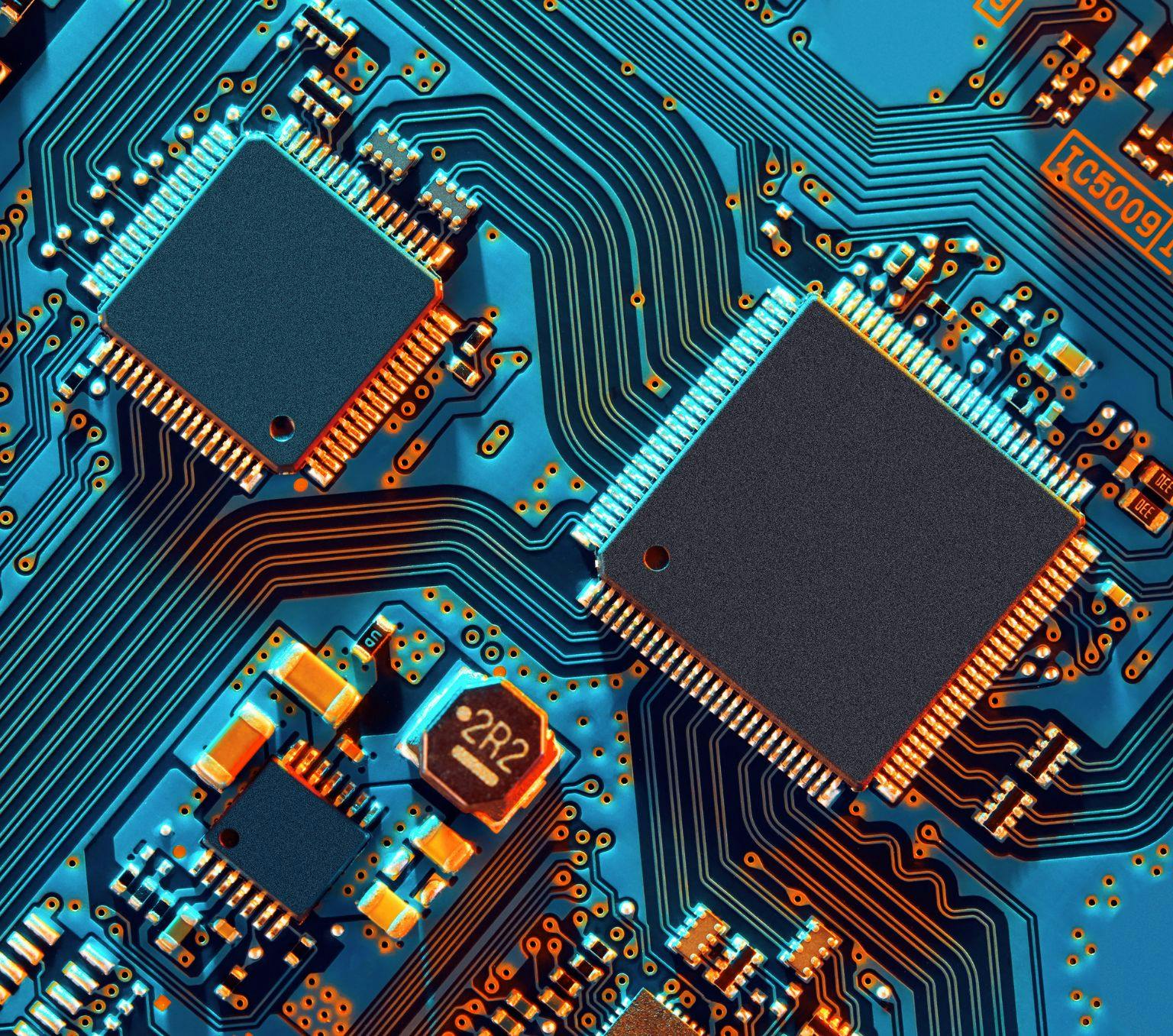 A circuit board for a piece of technology with blue colourings.