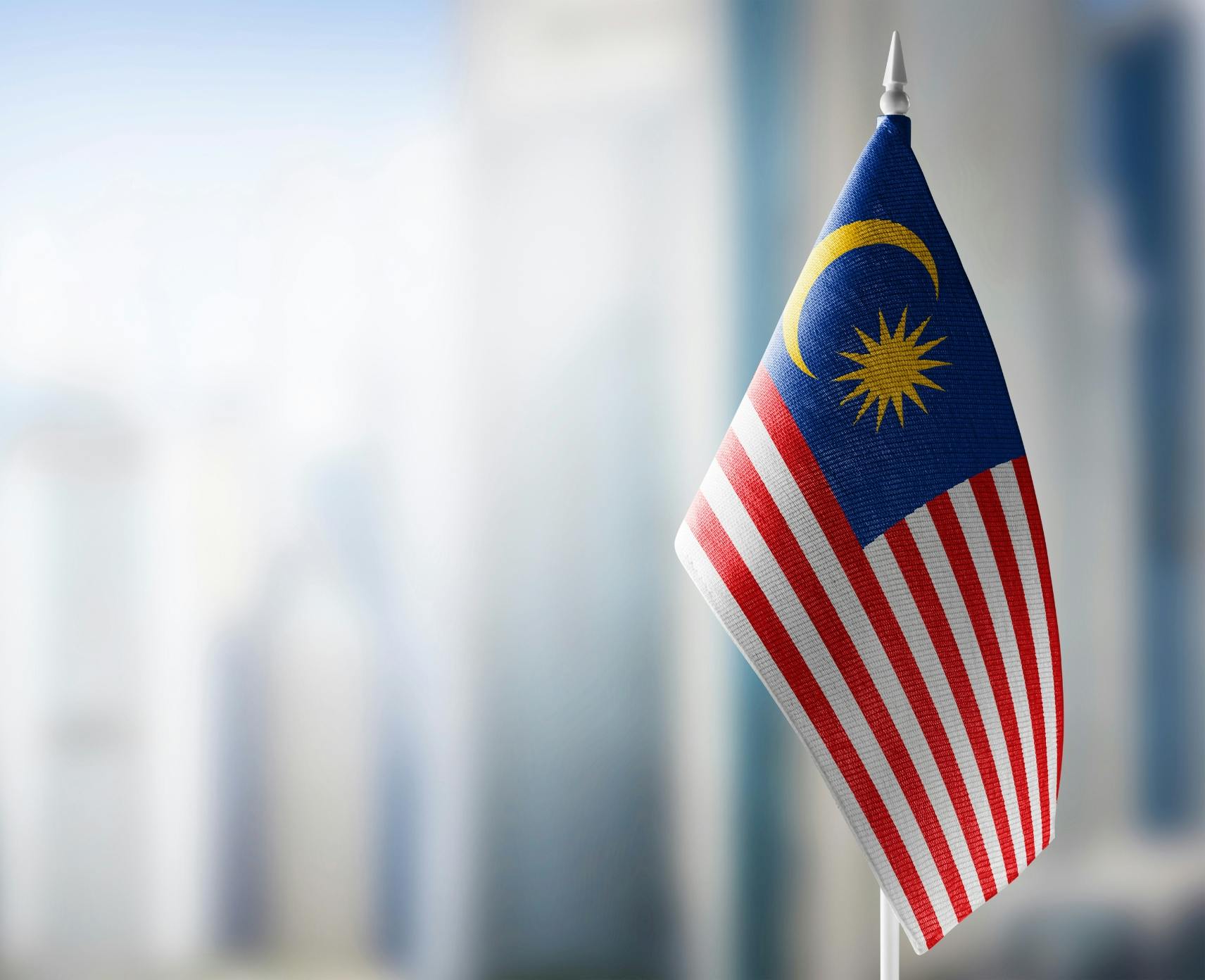 A small Malaysian flag with a blurred background