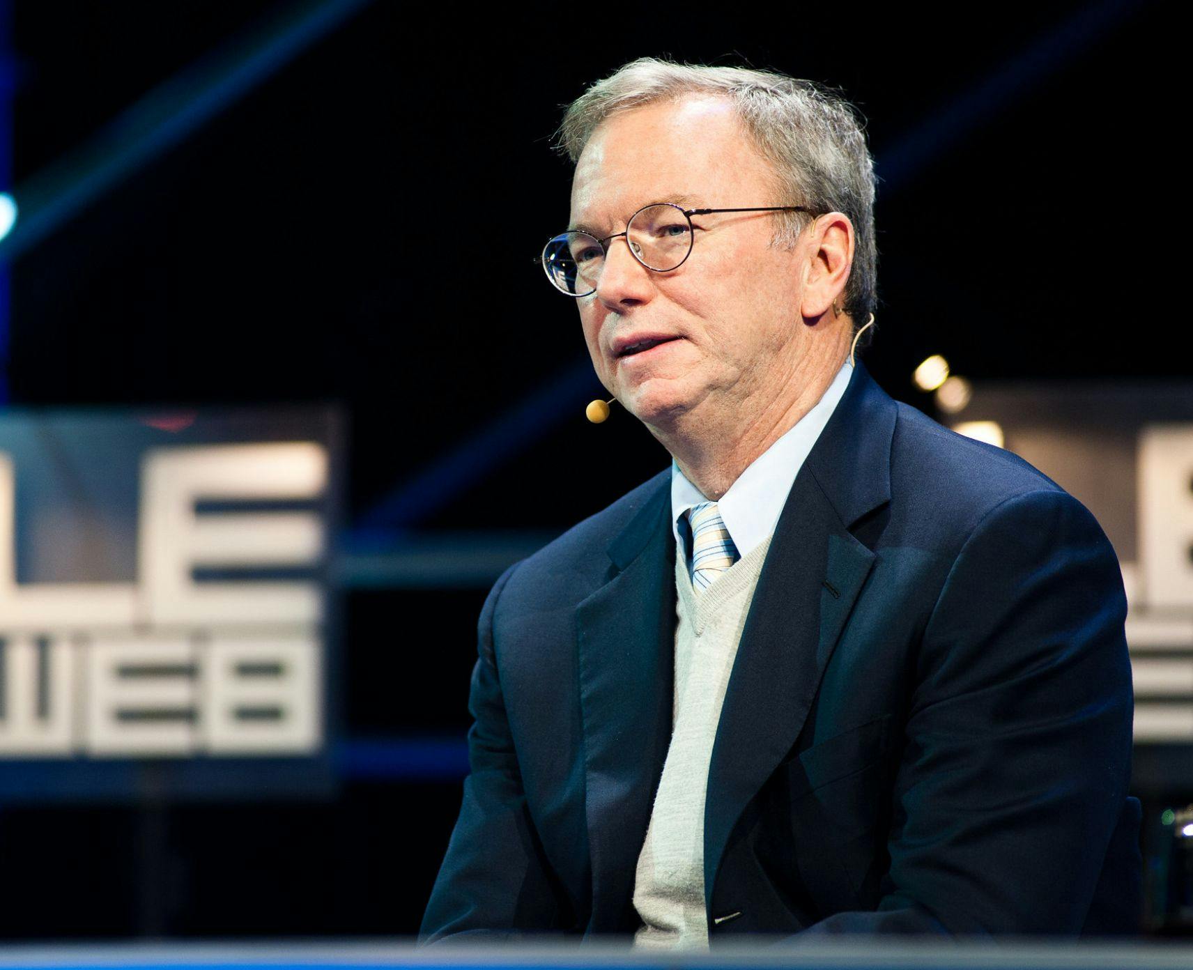 Former Google CEO Eric Schmidt sitting on a stage