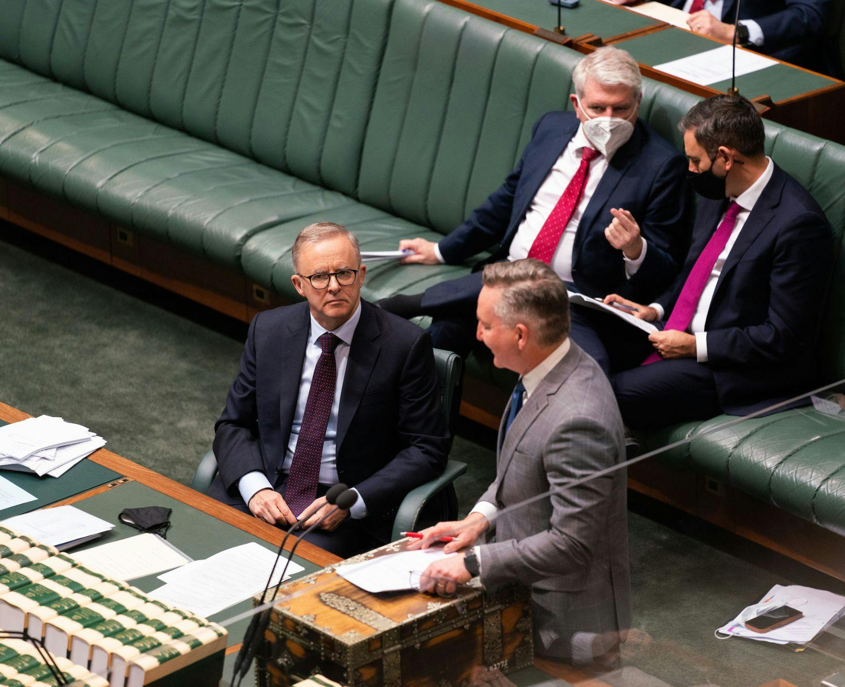 Anthony Albanese listens to Chris Bowen in the House of Representatives
