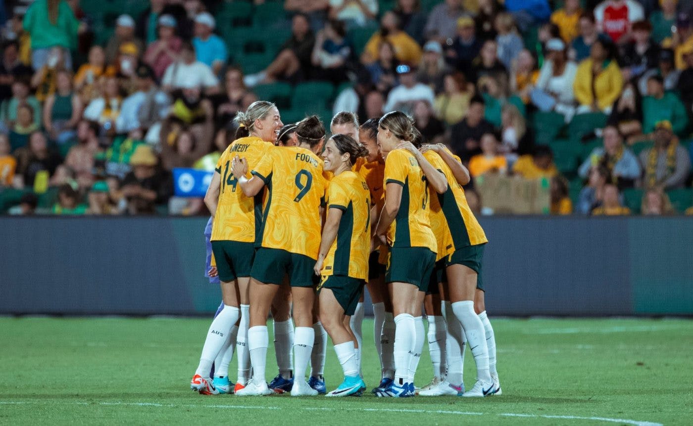 The Matildas in a team huddle.