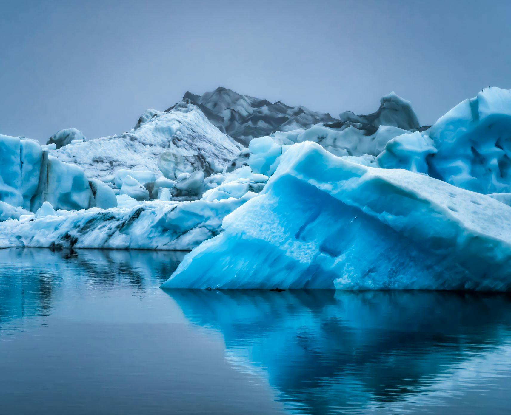 Antartic icebergs in different shades of blue.