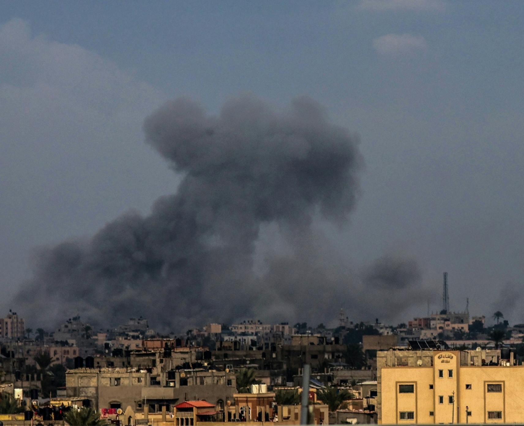 Smoke rising after an Israeli air strike on Khan Yunis in the southern Gaza Strip, 3 January 2024.